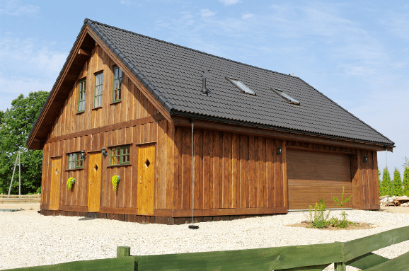 rustic garage with wood siding and metal roof