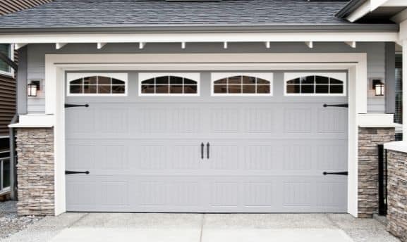 Gray garage door with glass panels 