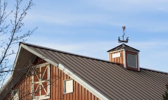 Garage build kit with metal roof and weathervane