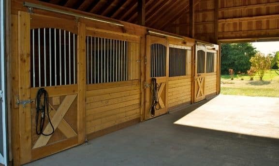 Horse barn interior of center aisle barn
