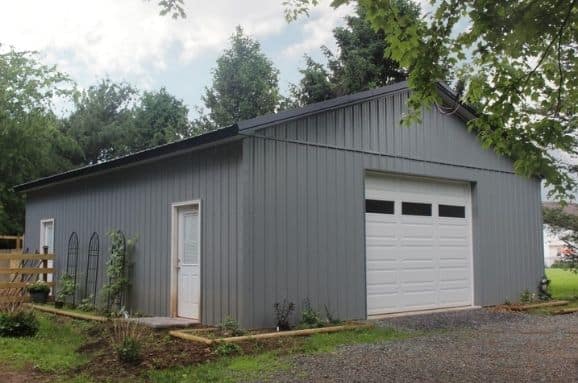 Large steel garage kit built for storing garden tools