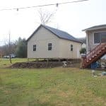 backyard view of a 24x24 2-car garage with attic for sale in glenmoore pa beside house