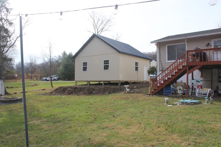 backyard view of a 24x24 2-car garage with attic for sale in glenmoore pa beside house