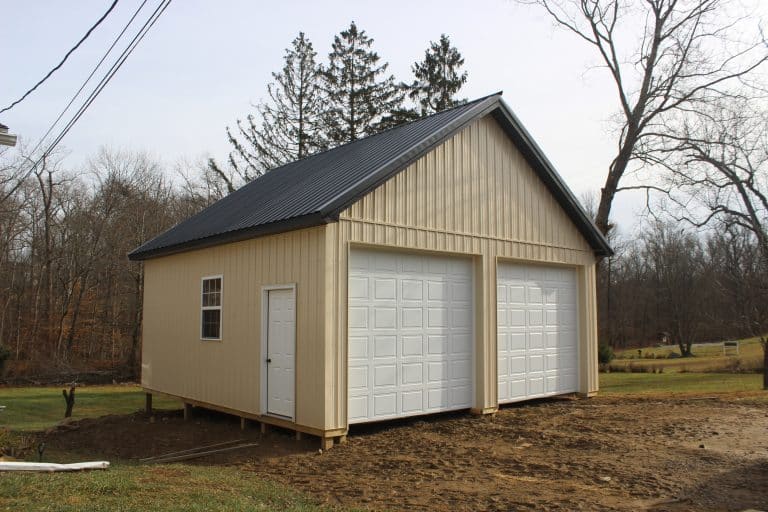 yellow and black 24x24 2-car garage with white doors for sale in glenmoore pa