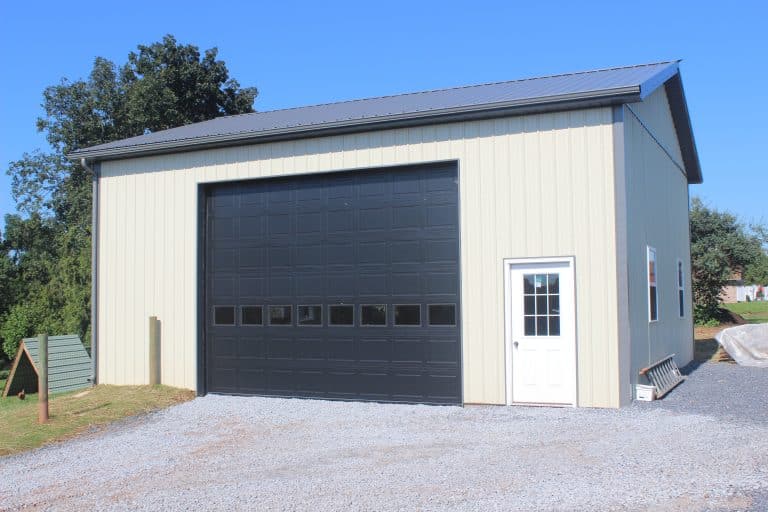 white door and black garage door on a 28x32 workshop for sale in new holland pa