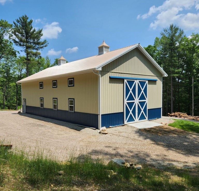 32x64 pole barn barn with everlast 27 guage metal roofing and siding, with white trim and blue metal wainscotting available for custom order sale in massachusetts