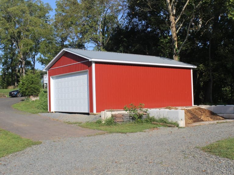 sideview of a red tractor shed for sale in douglassville PA